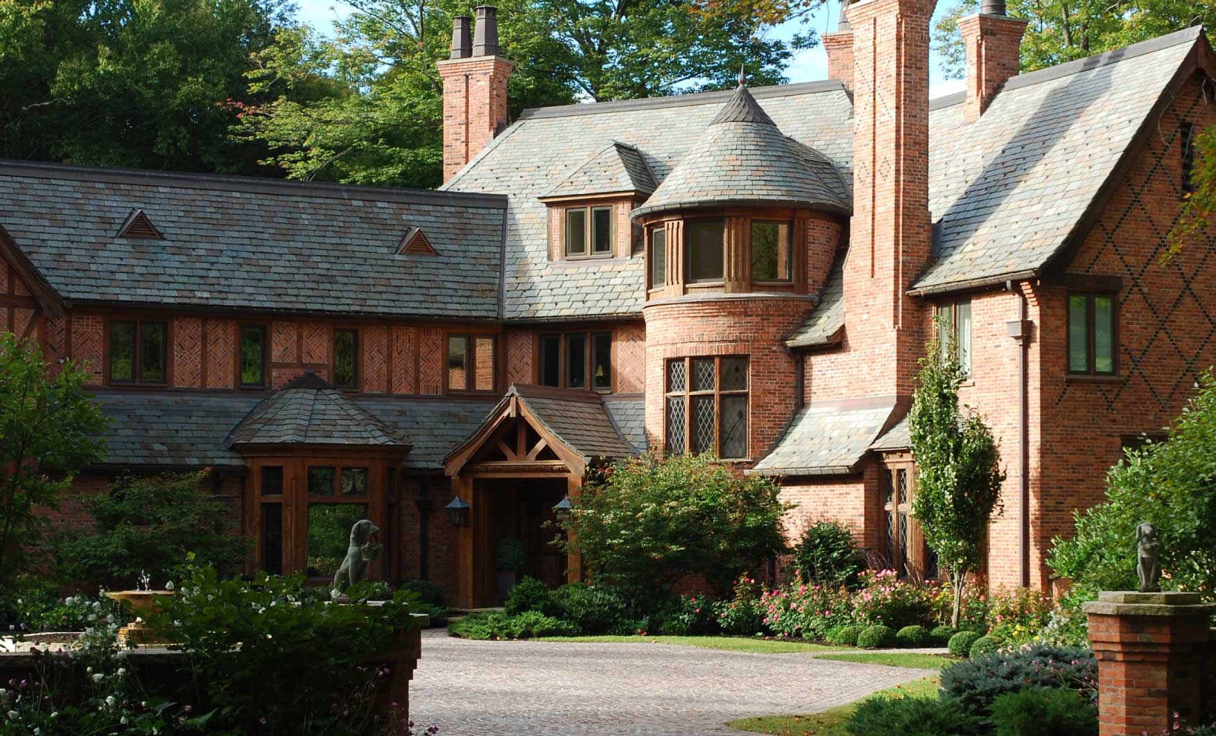 country-tudor-house-joe-dick-red-brick-front-driveway-turret-slate-garden